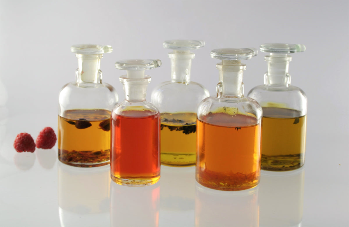 Small batch botanical oil infusion process using cold pressed berry seed oils